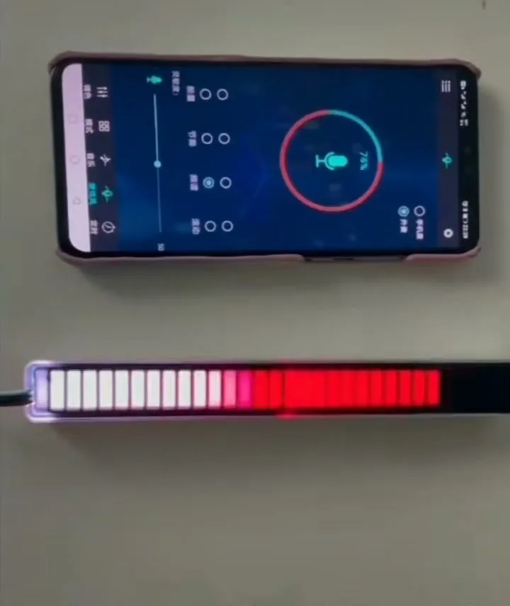 A sound-activated LED bar lit as a white-to-red level meter, with the control app open on a phone above it showing microphone sensitivity at 71 per cent.